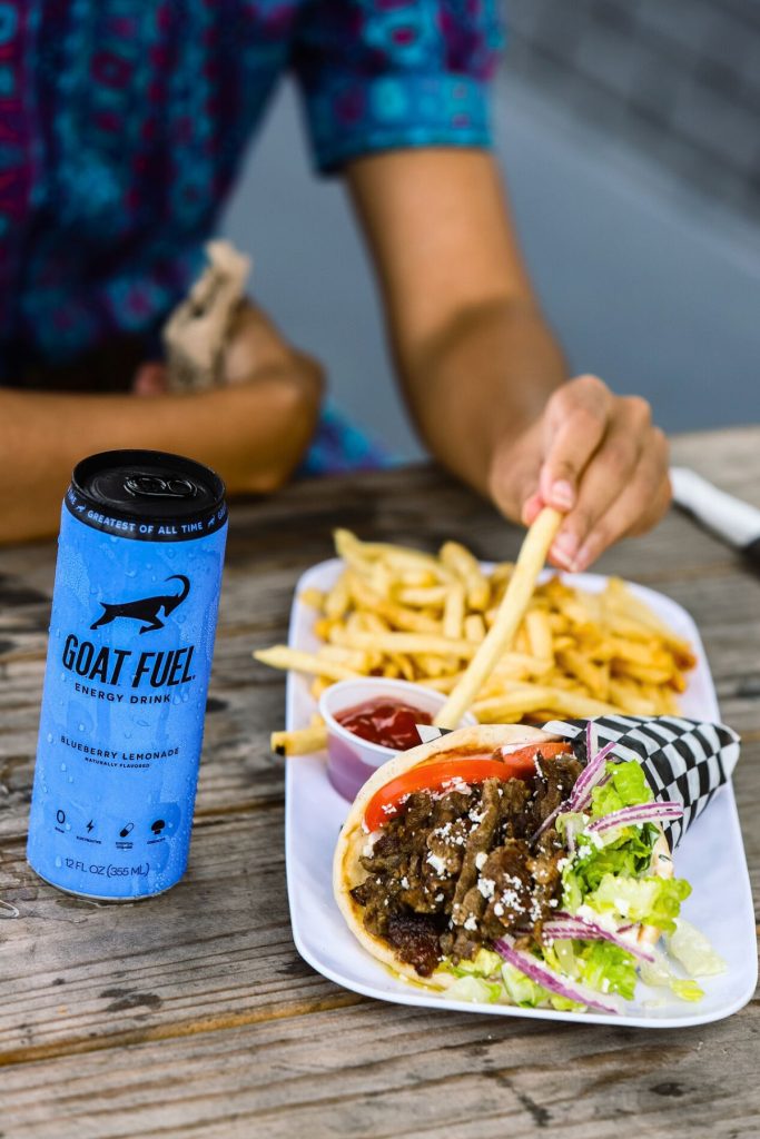 a closeup of woman enjoying french fries restaurat social media photography in Florida Port St Lucie