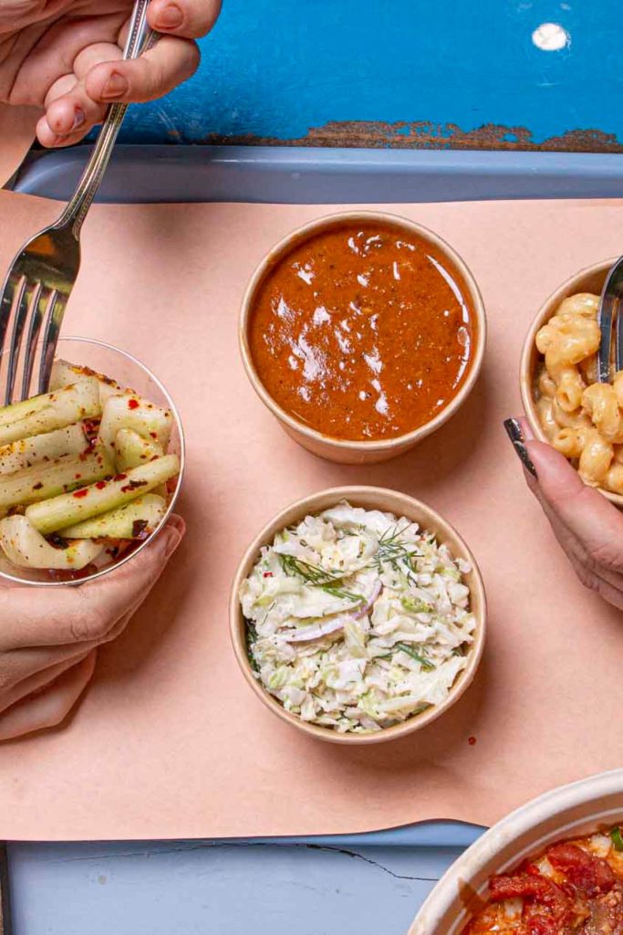 Closeup of people eating food with forks in cups social media photography in Florida West Palm Beach