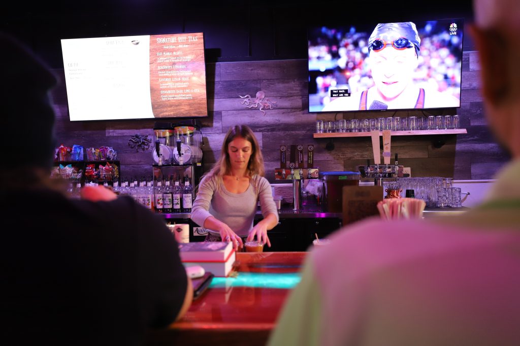 a photo of kava bar environment with worker making kava in fort pierce at rooted reef kava bar